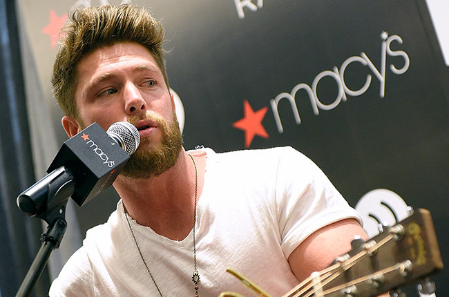 WINSTON SALEM, NC - MAY 16:  Macy's iHeartRadio Rising Star Chris Lane performs at Macy's Hanes on May 16, 2015 in Winston Salem, North Carolina.  (Photo by Grant Halverson/Getty Images for iHeart Media)